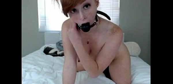  Redhead Girl puts a kitten tail in the ass and gag in mouth on cam